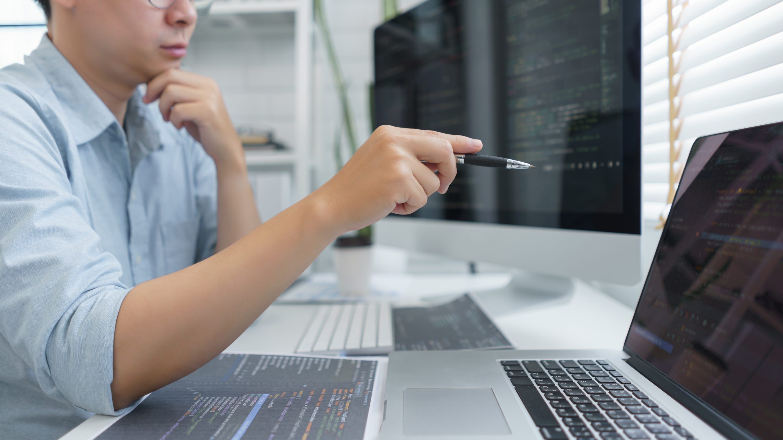 Software developer looking at code created with AI